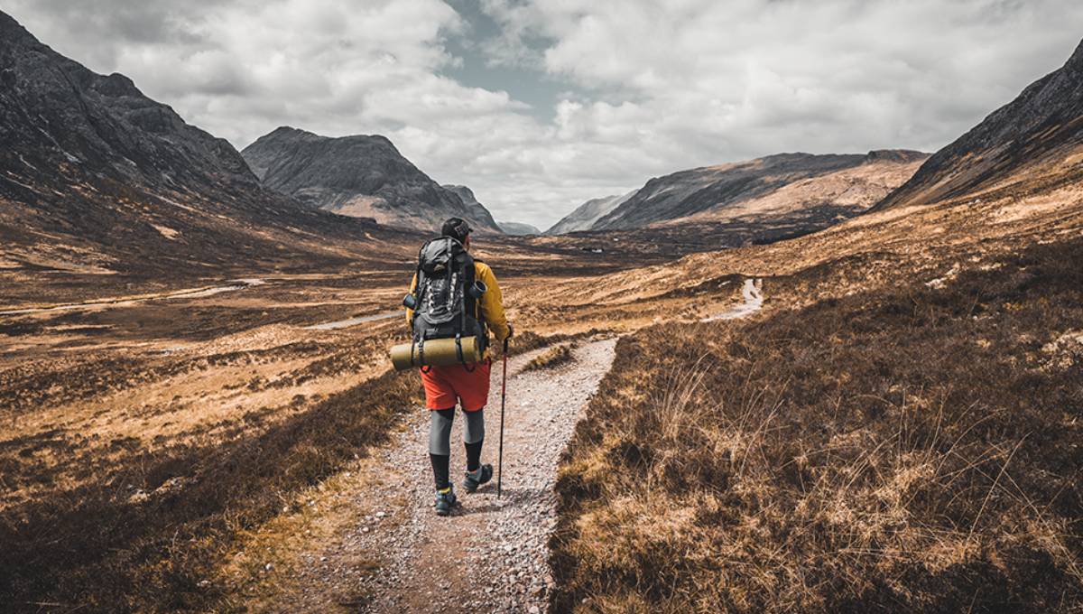 Man hiking through mountains