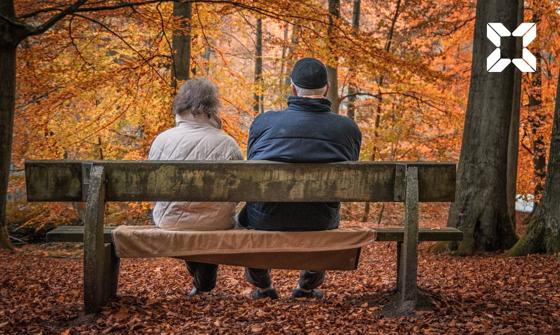 Couple sat on bench outside