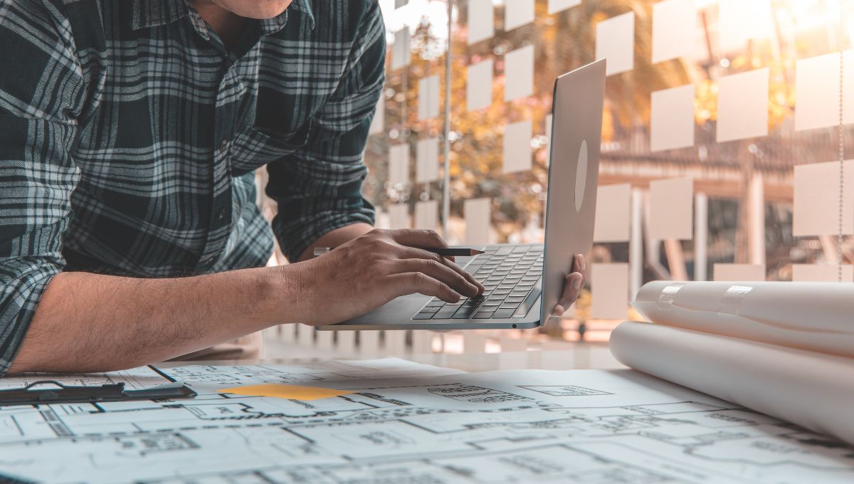 An architect drawing out a building plan