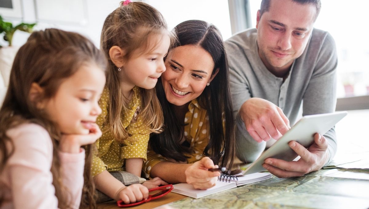 A couple teaching their kids