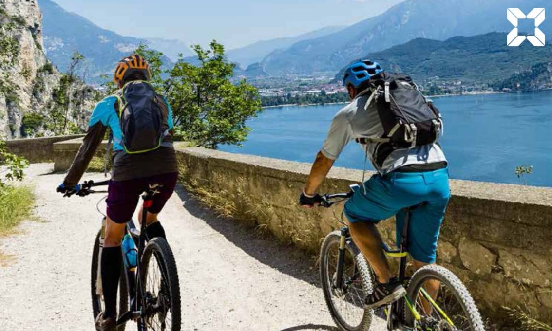 Couple cycle overlooking scenic views