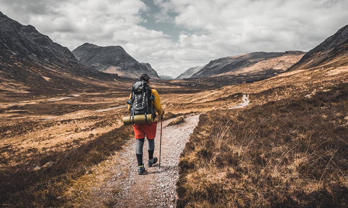 Man hiking through mountains