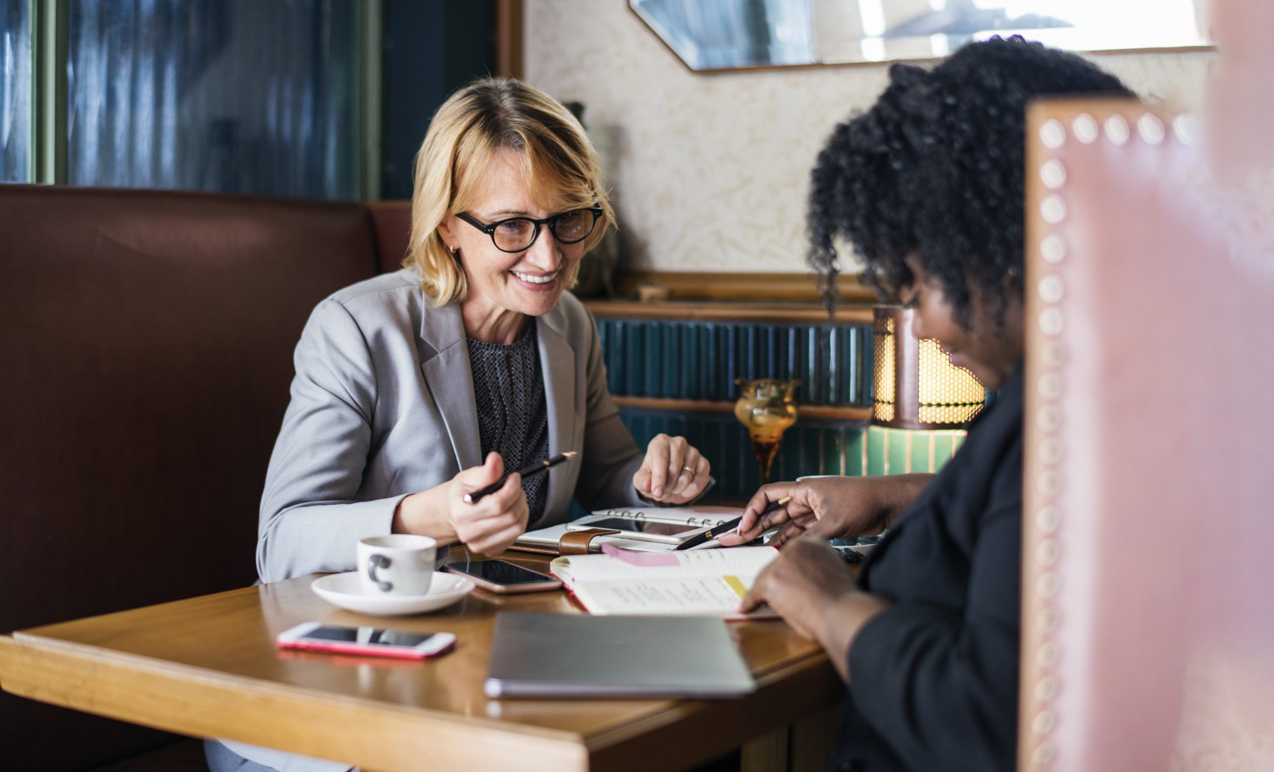 Two women in a business meeting.